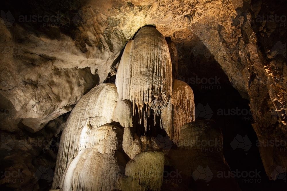 Crystal stalactite rock formation in Cathedral Cave at Wellington - Australian Stock Image