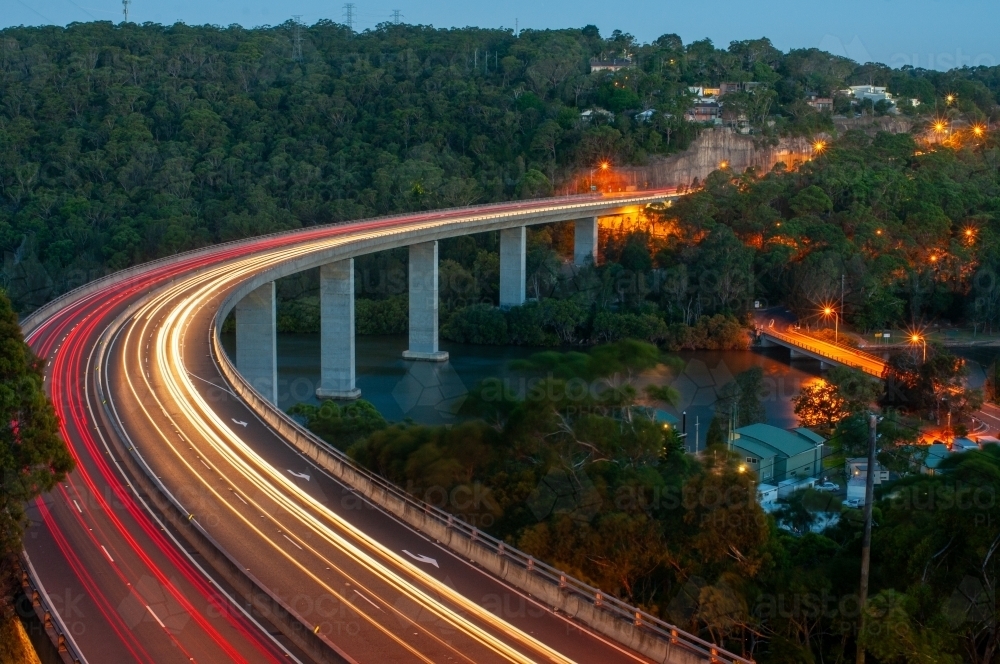 Curved bridge with car lights in a long exposure - Australian Stock Image