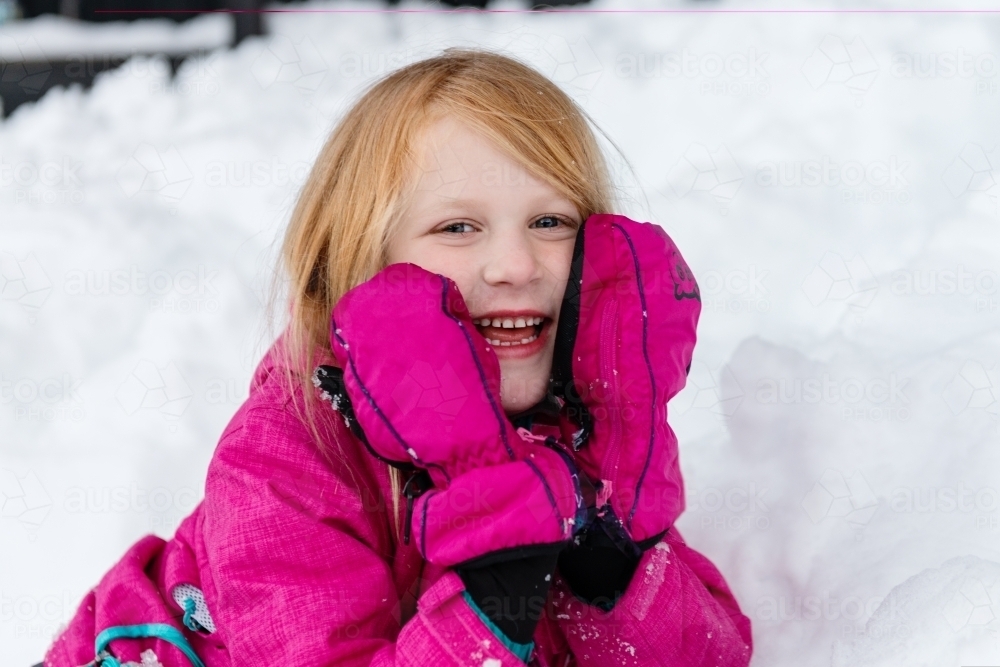 cute red head girl in the snow - Australian Stock Image