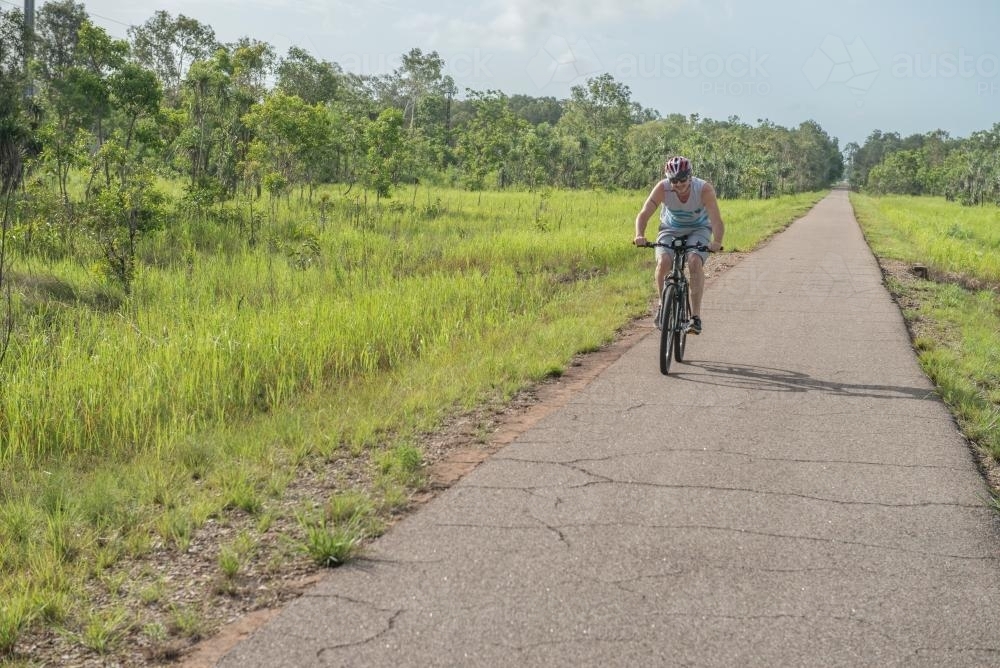 Cyclist on bush bike path - Australian Stock Image