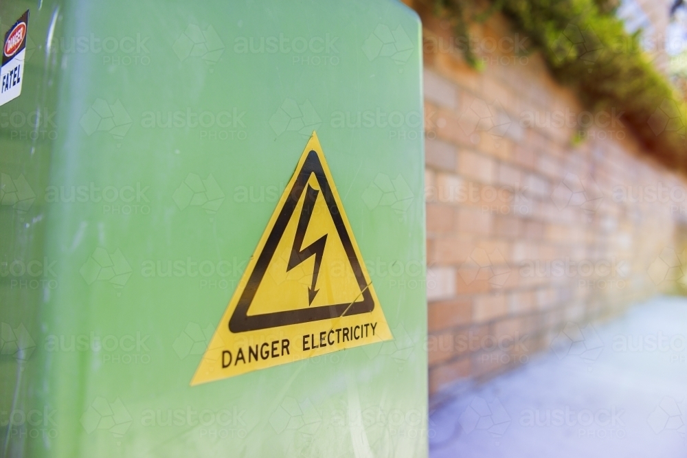 Danger electricity green box on street - Australian Stock Image