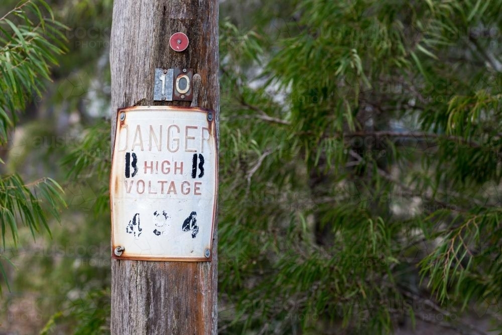 Danger high voltage notice on power pole - Australian Stock Image