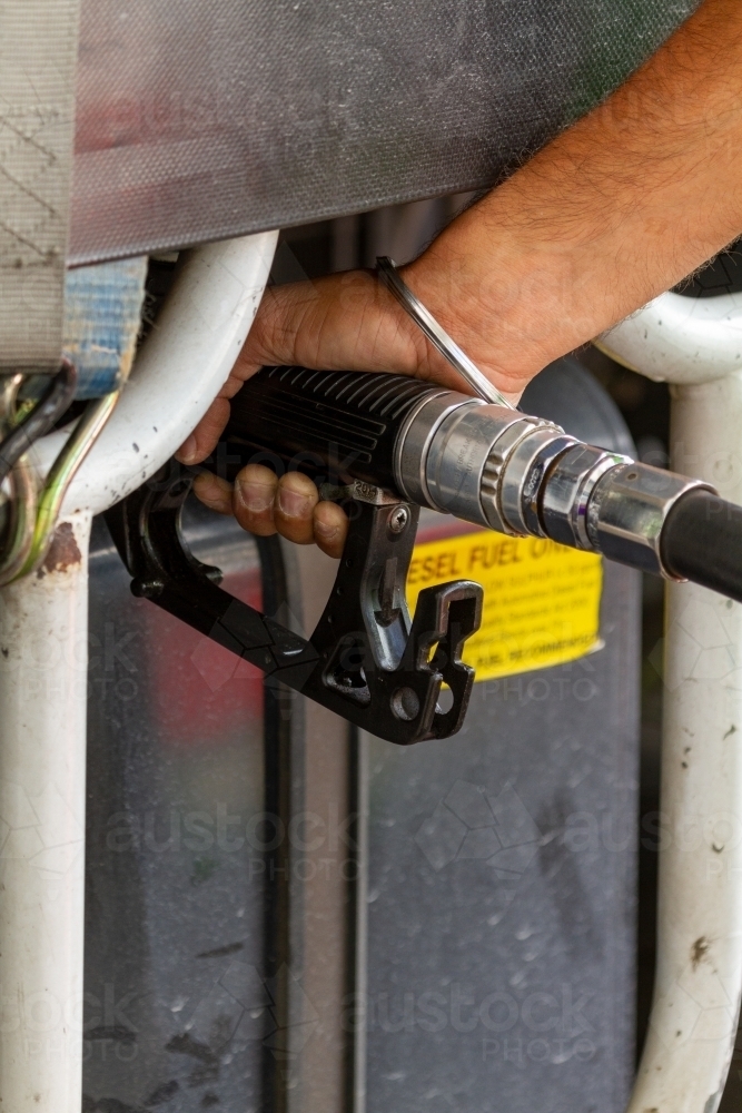 Diesel nozzle fuelling truck. - Australian Stock Image