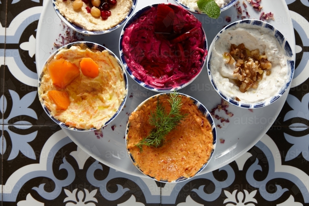 different flavours of hummus on one plate - Australian Stock Image