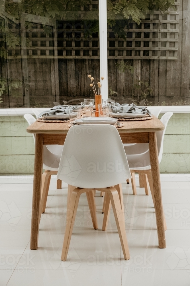 Dinner table set for guests. - Australian Stock Image