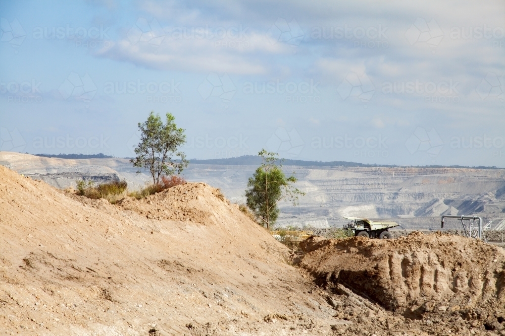 Dirt and open cut coal mine with dump truck - Australian Stock Image