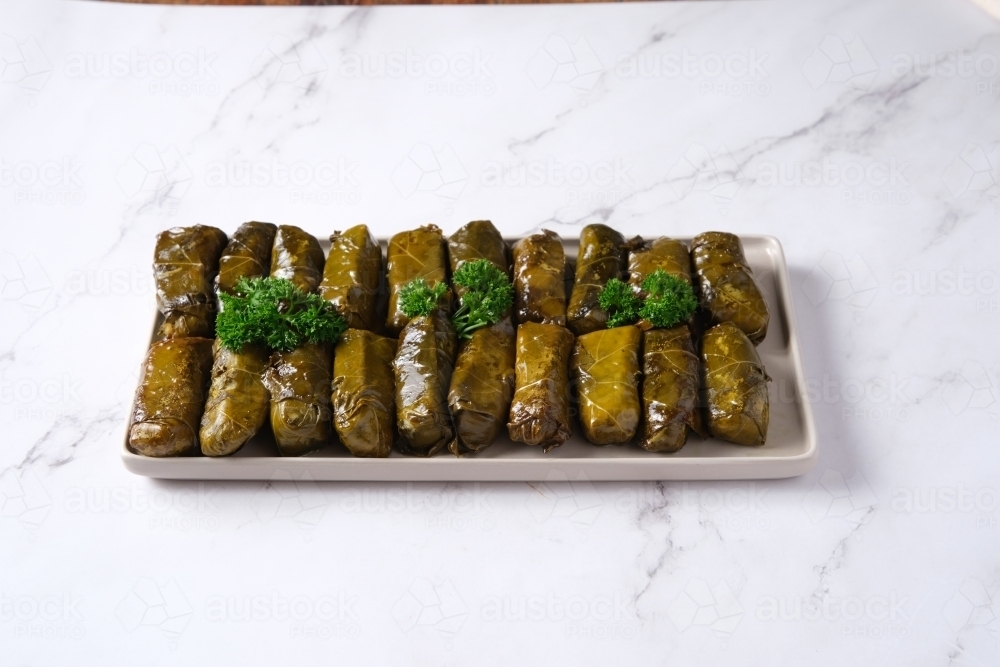 Dish of stuffed grape leaves - Australian Stock Image