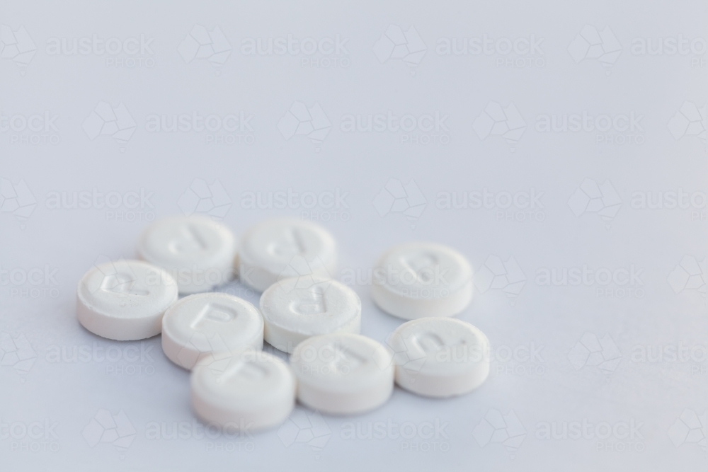 Dissolvable anti nausea pills on white - Australian Stock Image