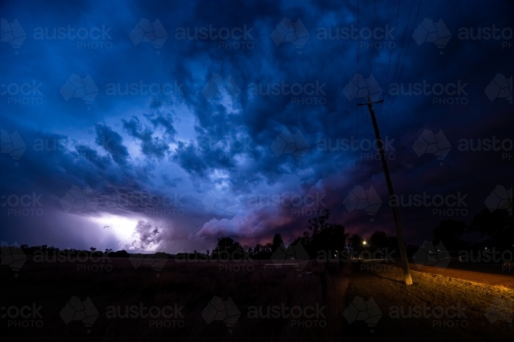 Dramatic Summer storm clouds and lightening - Australian Stock Image