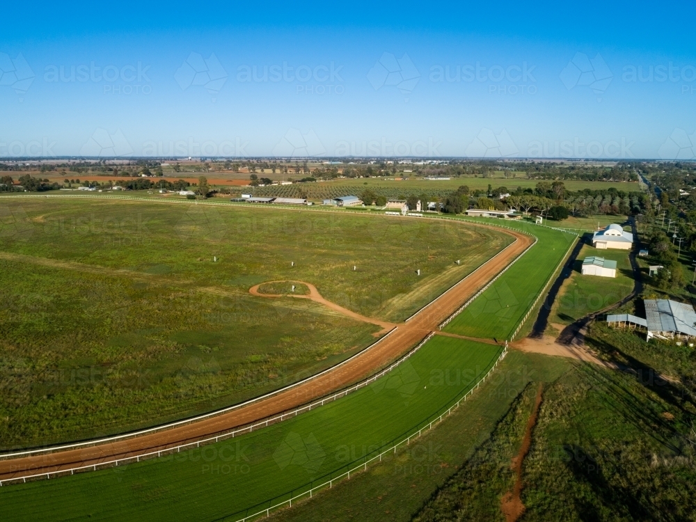 Drone image of country racecourse with dirt training track and neat green racetrack - Australian Stock Image