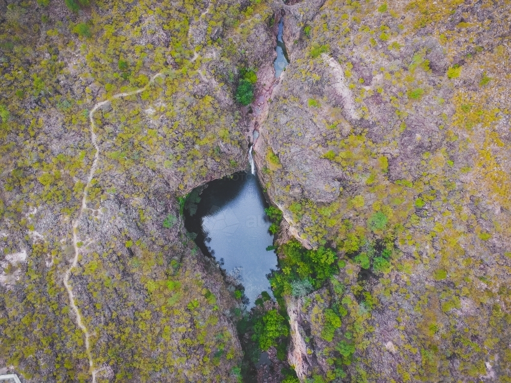 Image of Drone photo of waterfall and swimming hole surrounded by ...