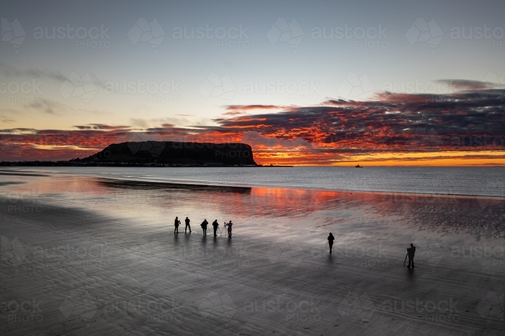 Drone view of photographers capturing sunrise over Nut at Stanley - Australian Stock Image