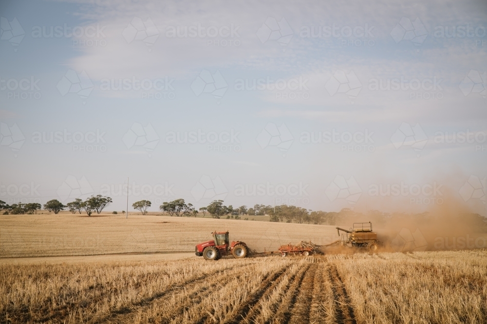 Dry seeding crop into stubble in paddock in the Avon Valley of Western Australia - Australian Stock Image