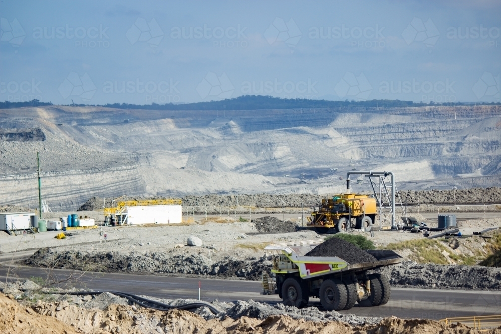 Dump truck carting coal through open cut mine in the hunter valley - Australian Stock Image