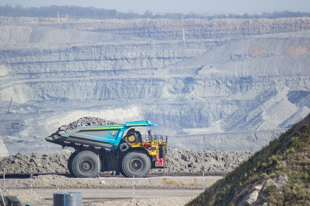 Dump truck carting coal through open cut mine in the hunter valley - Australian Stock Image