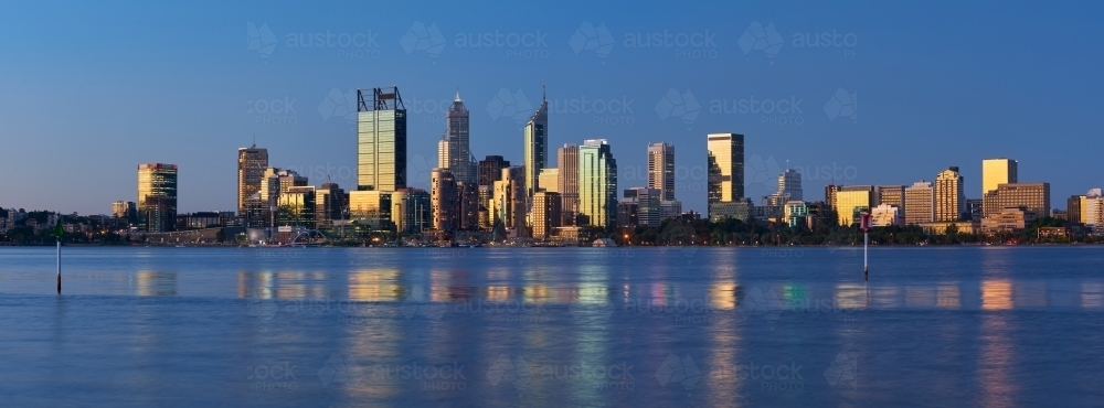 Dusk cityscape of Perth, Australia, with the sunset reflecting off the skyscraper windows - 2021 - Australian Stock Image