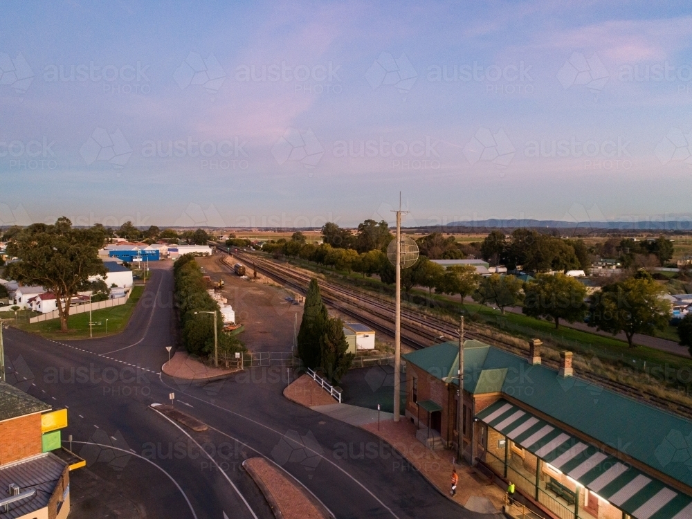 Dusk sky over train station and railway track - Australian Stock Image