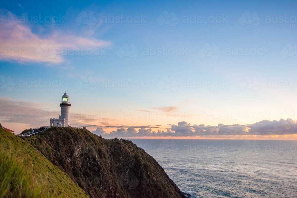 Early morning dawn showing Byron Bay lighthouse and coastline - Australian Stock Image