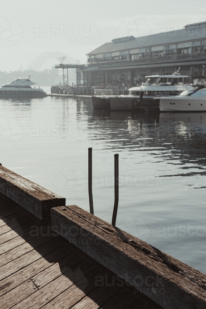 Early morning sun haze over the water at Pirrama Park/Jones Bay Wharf, Sydney NSW. June 2019 - Australian Stock Image