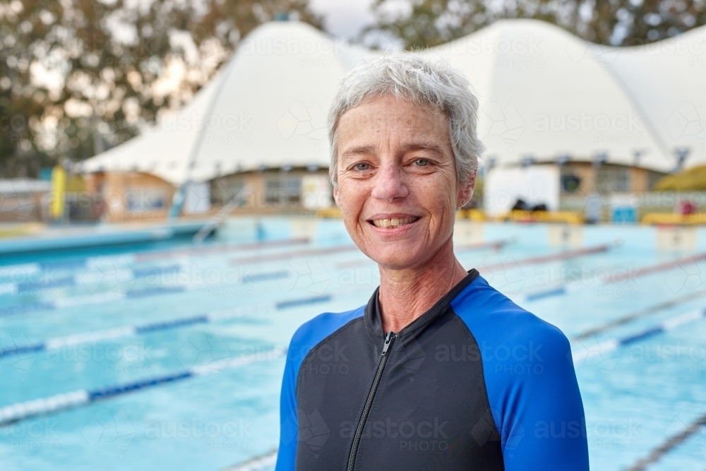 Elderly swimmer at pool - Australian Stock Image