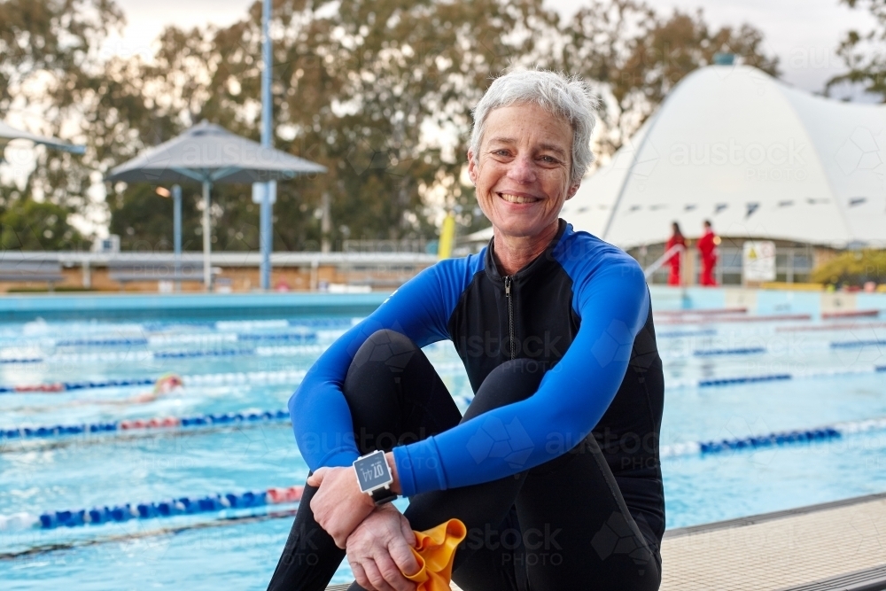 Elderly swimmer at pool - Australian Stock Image