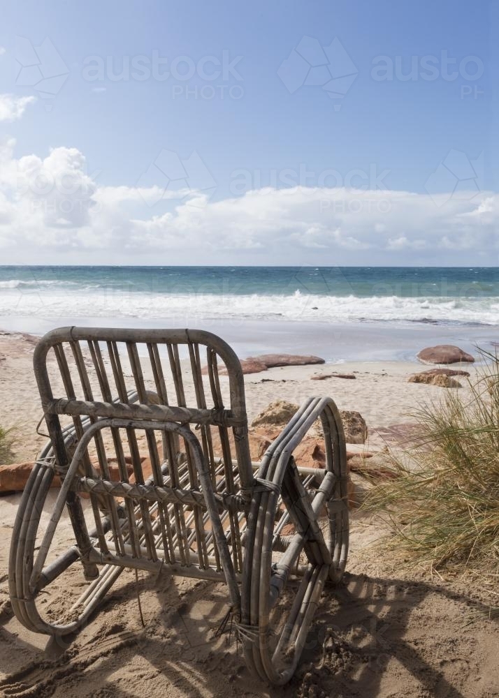 Empty chair overlooking the ocean - Australian Stock Image