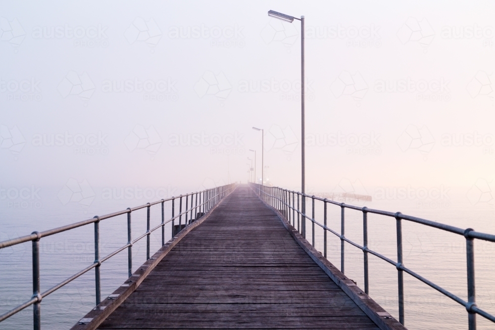 empty jetty on foggy morning - Australian Stock Image