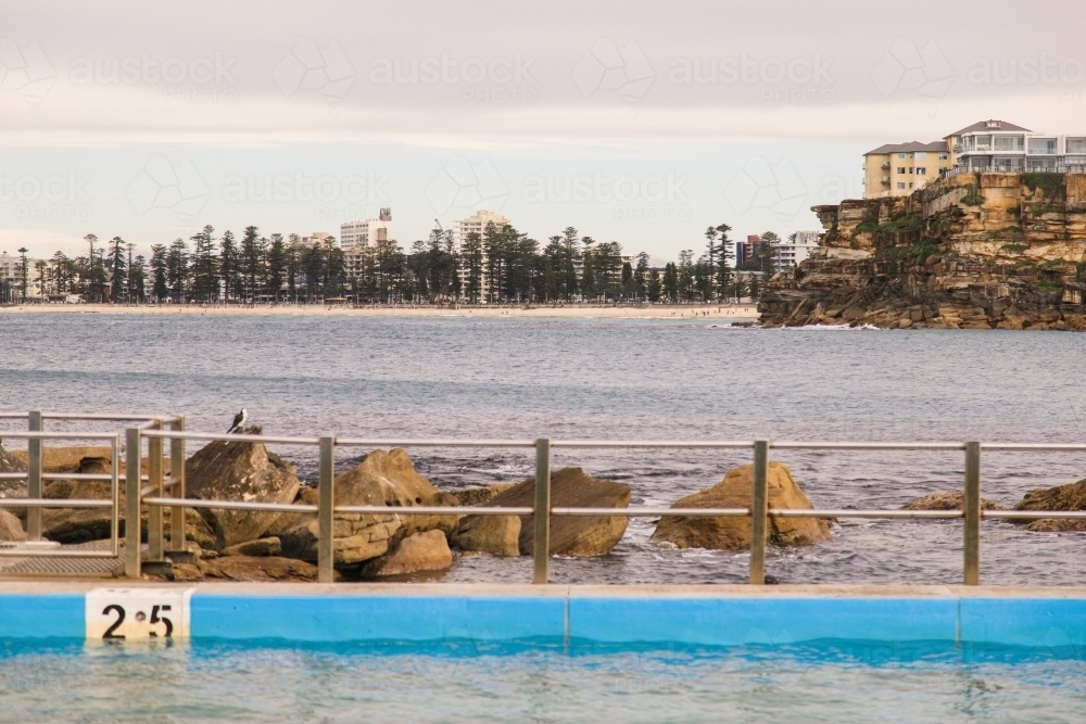 Empty ocean pool with urban and suburban background - Australian Stock Image