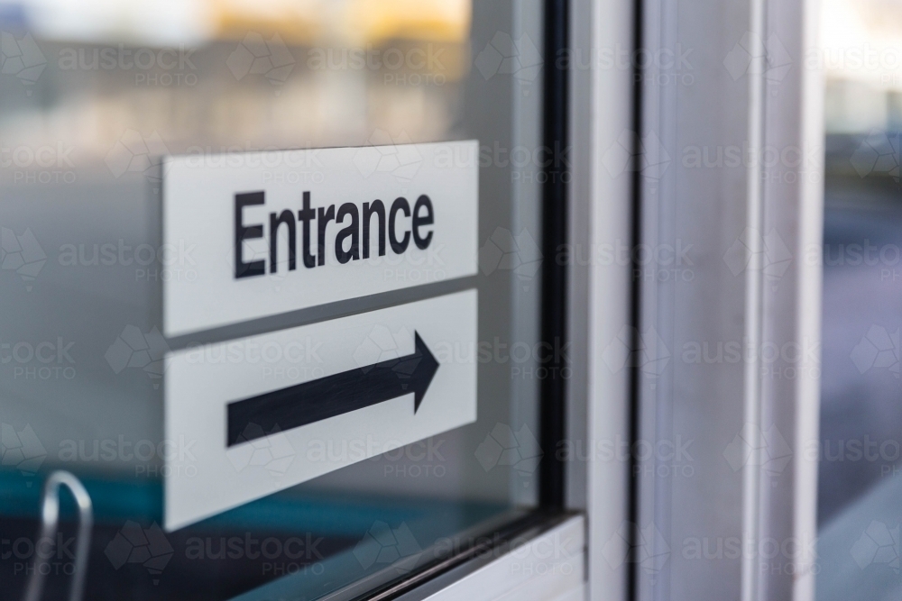 Image of Entrance sign with black arrow - Austockphoto