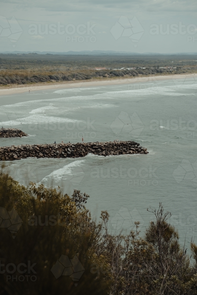 Evan's Head main beach and breakwall as seen from Razorback Lookout. - Australian Stock Image