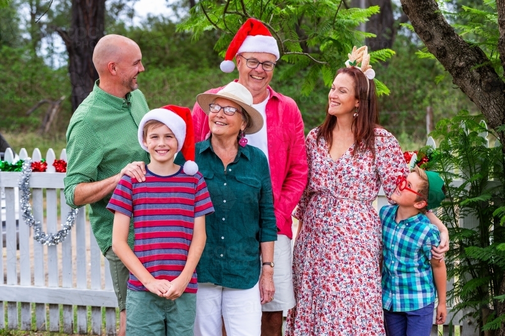 Extended family portrait with grandparents and grandkids at Christmas family gathering - Australian Stock Image