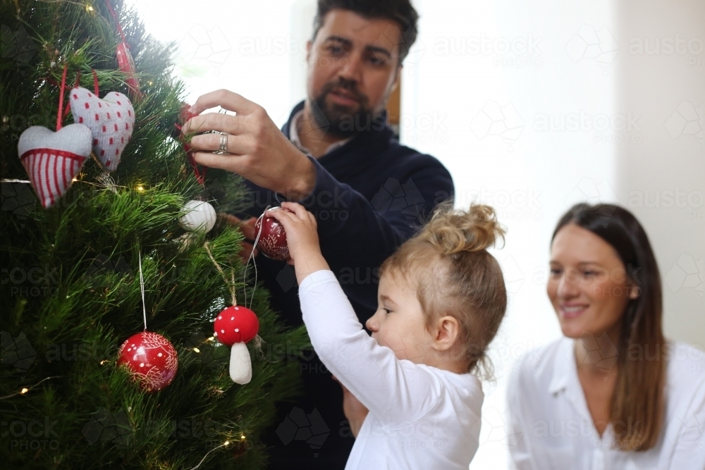 Family decorating Christmas Tree - Australian Stock Image