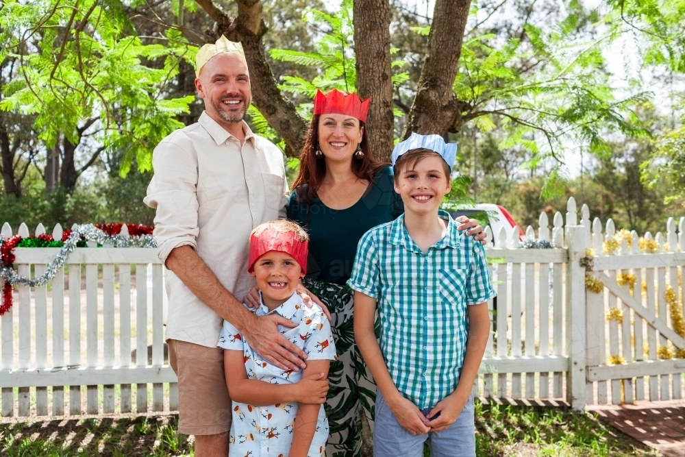 Family portrait under jacaranda tree at Christmas time    - Australian Stock Image