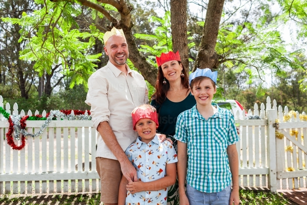 Family portrait under jacaranda tree at Christmas time    - Australian Stock Image