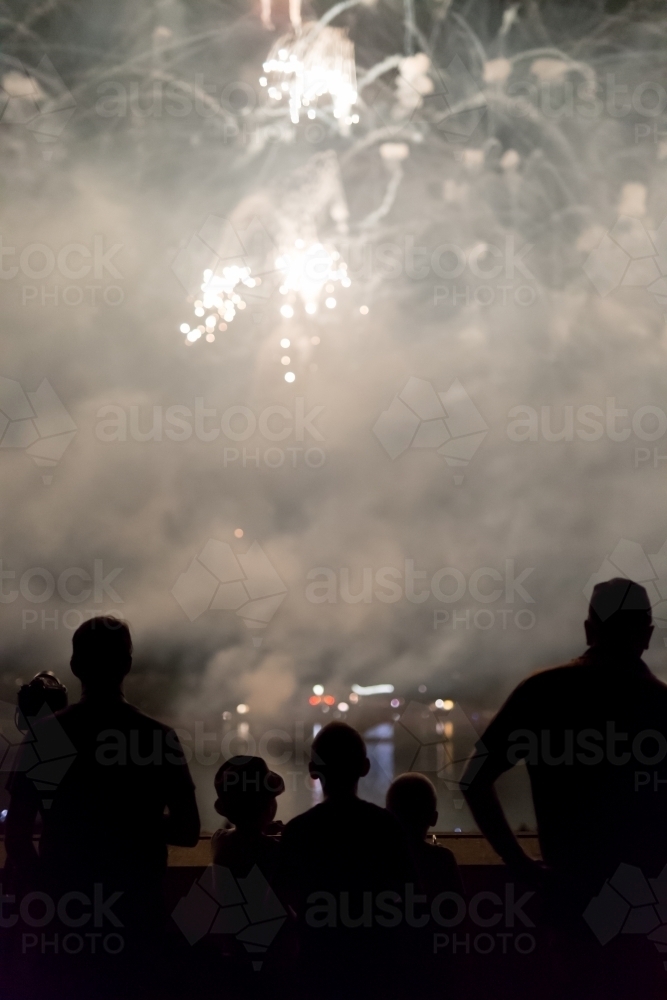 Family watching the fireworks display at skyfire, Canberra - Australian Stock Image