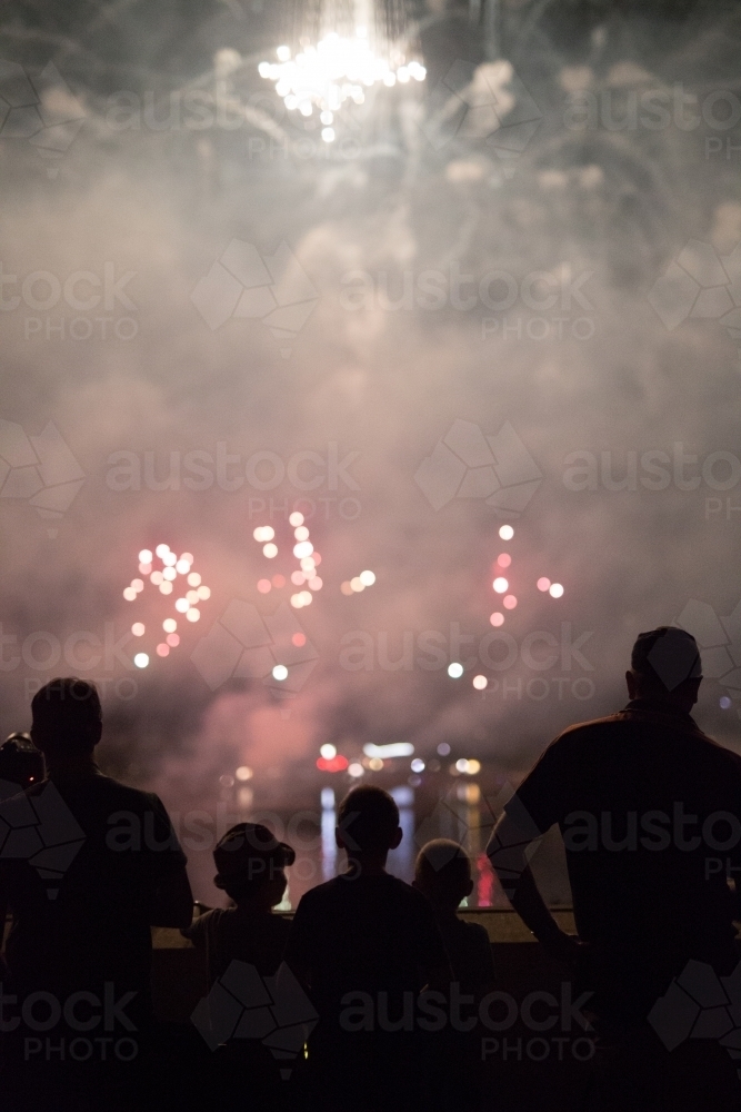 Family watching the fireworks display at skyfire, Canberra - Australian Stock Image