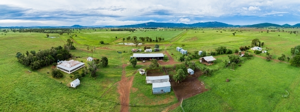 Farm buildings and stockyard seen from above on overcast day - Australian Stock Image