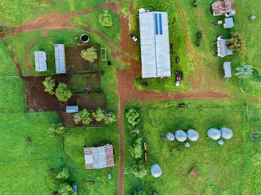 Farm buildings and stockyard seen from above on overcast day - Australian Stock Image