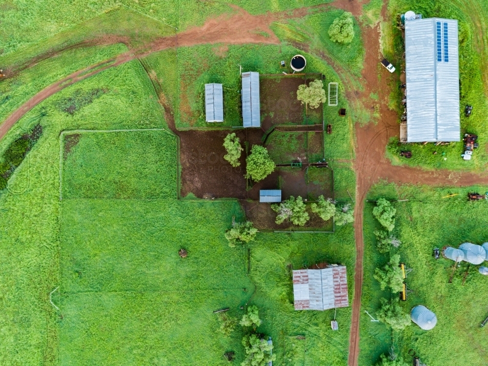 Farm buildings and stockyard seen from above on overcast day - Australian Stock Image