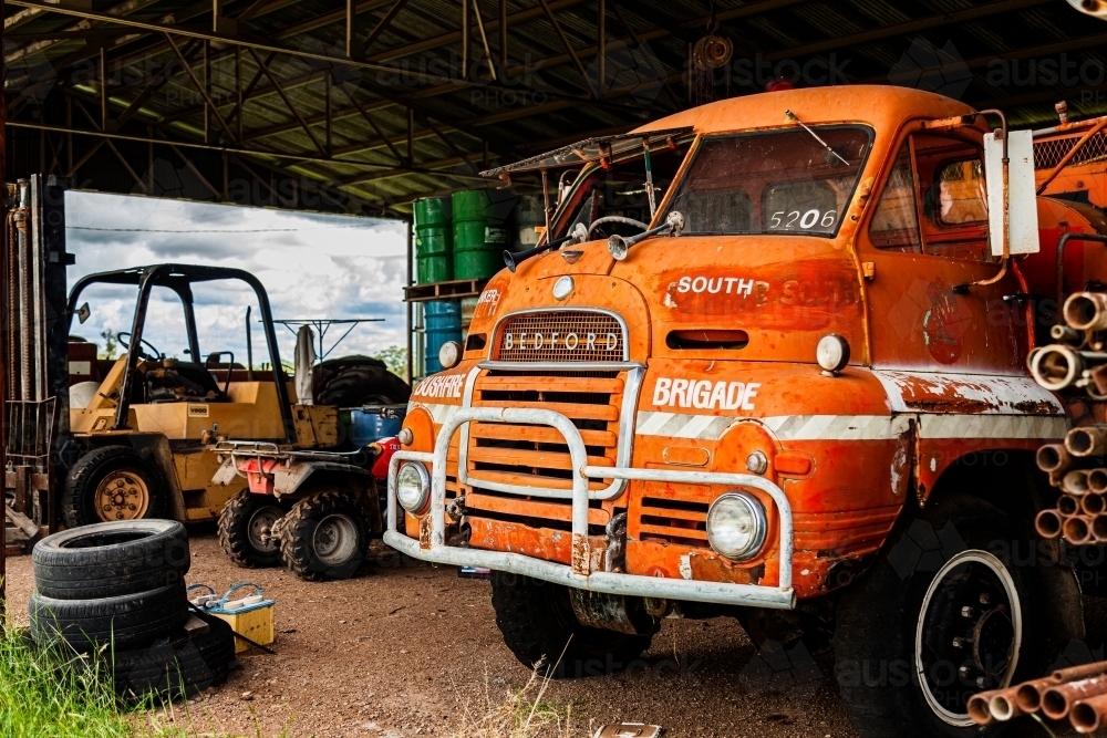 Farm fire brigade truck parked in shed - Australian Stock Image