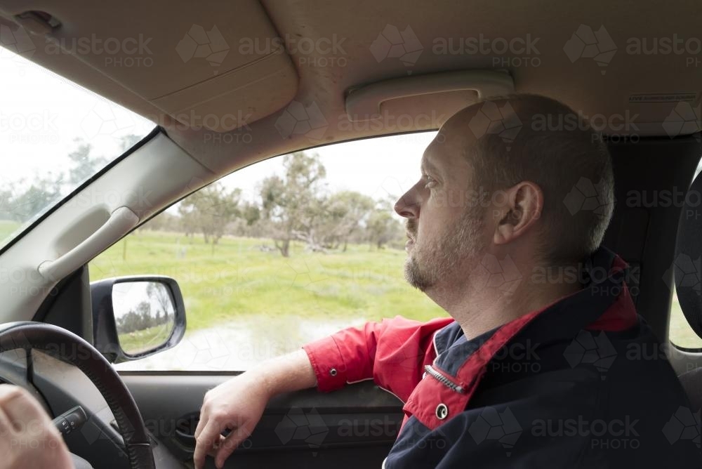 Farmer driving his car - Australian Stock Image