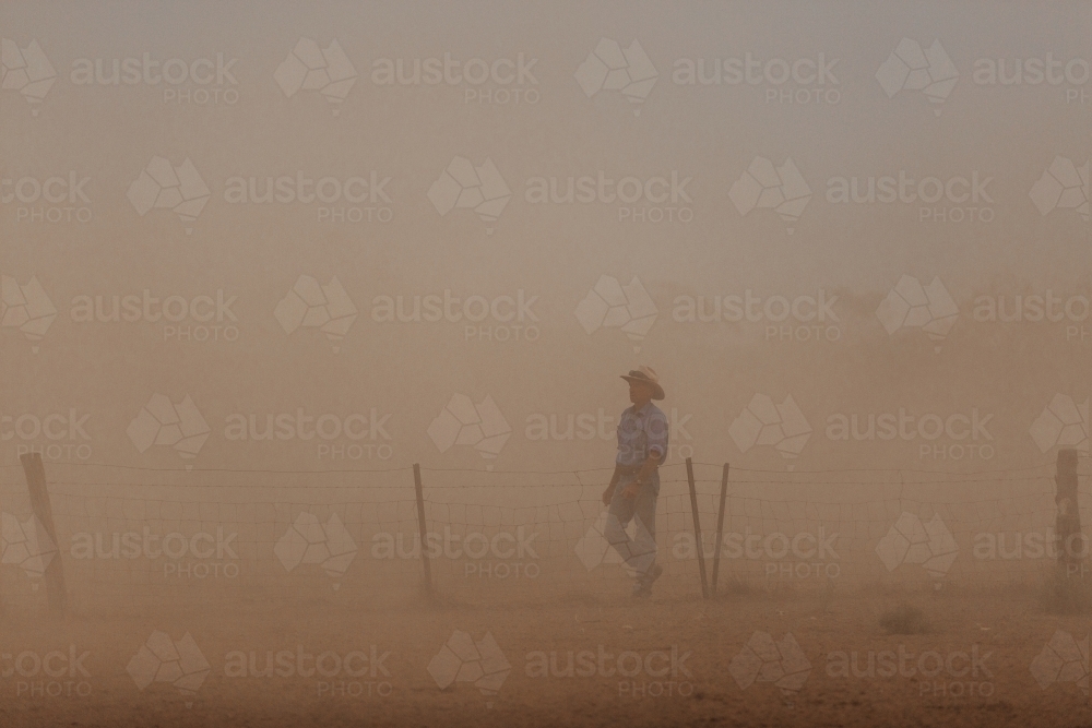 Farmer in dust storm - Australian Stock Image