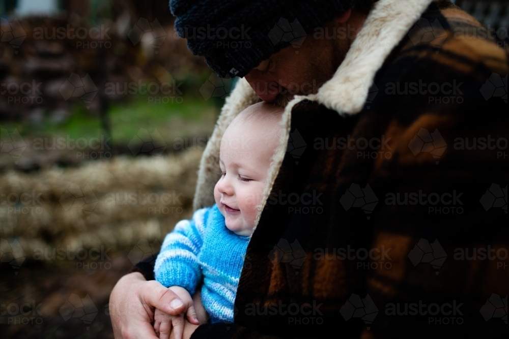 Father and baby on winter day - Australian Stock Image