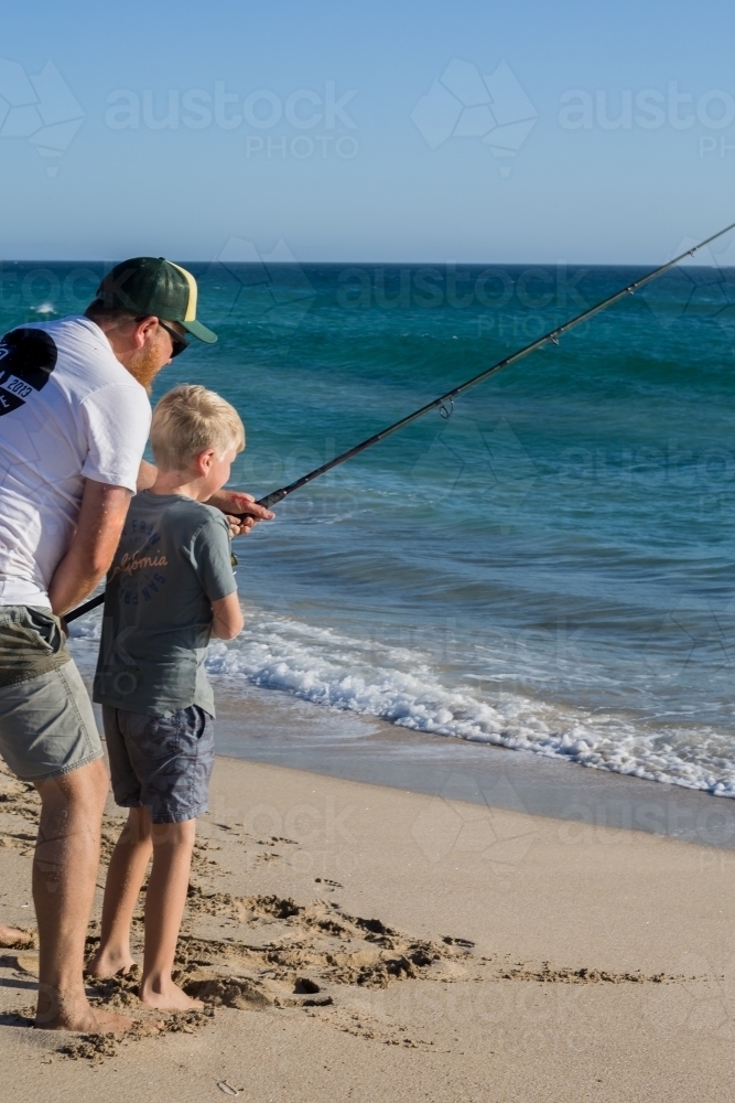 Father and son beach fishing - Australian Stock Image