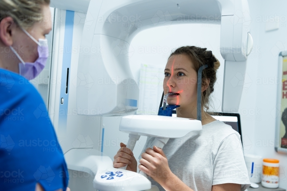 Female having X-ray of teeth and jaws - Australian Stock Image