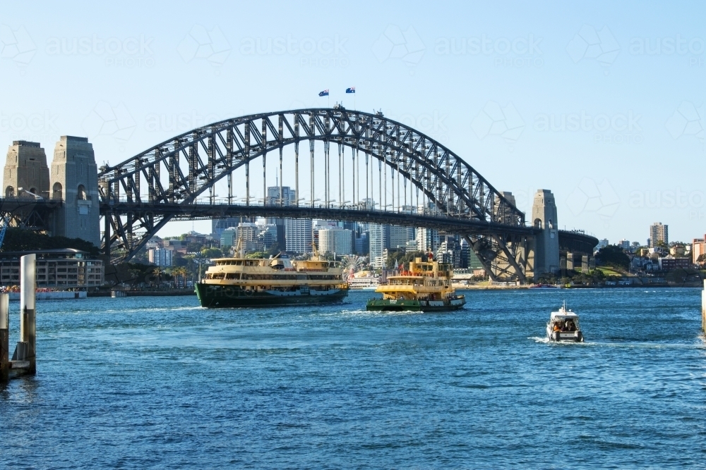 Ferries on Sydney Harbour with Bridge in the background - Australian Stock Image