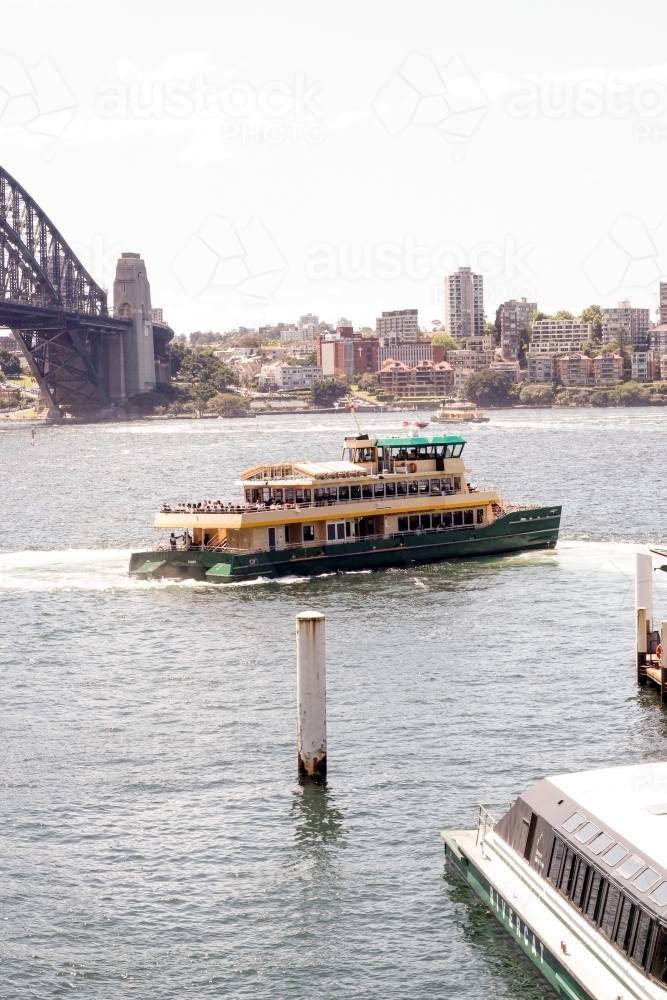 Ferry in Sydney Harbour near bridge - Australian Stock Image