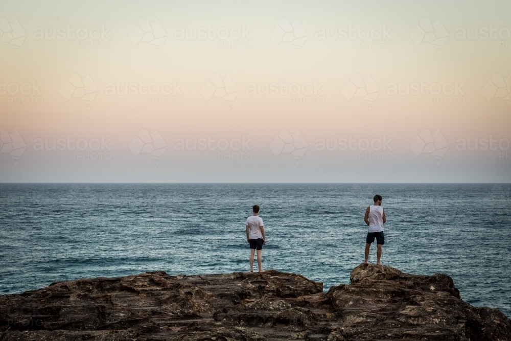 Figures overlooking the ocean - Australian Stock Image