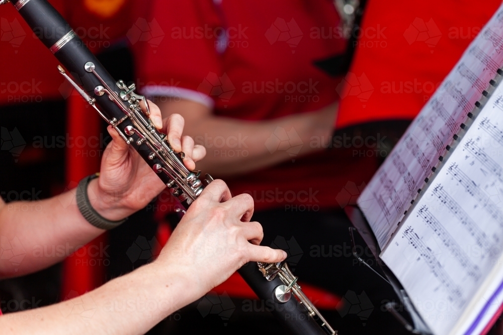 Fingers of young clarinet player playing with local town band at event - Australian Stock Image