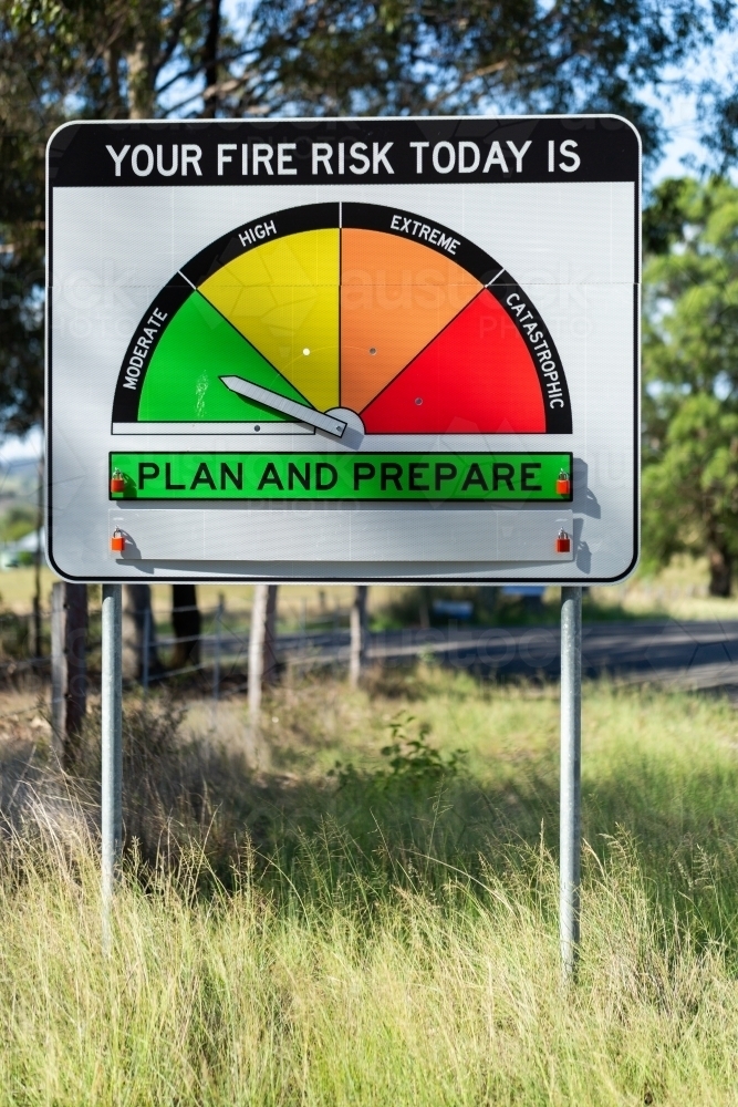 Fire danger rating sign on rural roadside in NSW Australia reading moderate plan and prepare - Australian Stock Image